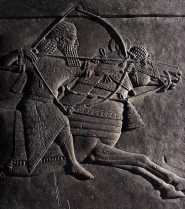 One of the Nineveh reliefs of an Assyrian war king dressed up for the hunt and pursuing his quarry. The king, Assurbanipal, like most Assyrian rulers would lead his troops into battle. Many intense bas-relief sculptures were unearthed from ruined palaces in Nineveh.